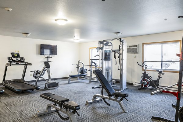 State-of-the-art fitness center at Plantation at Hunters Run Apartments offering modern workout equipment and spacious exercise areas