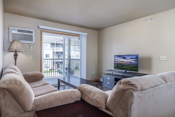 living room at Plantation at Hunters Run Apartments