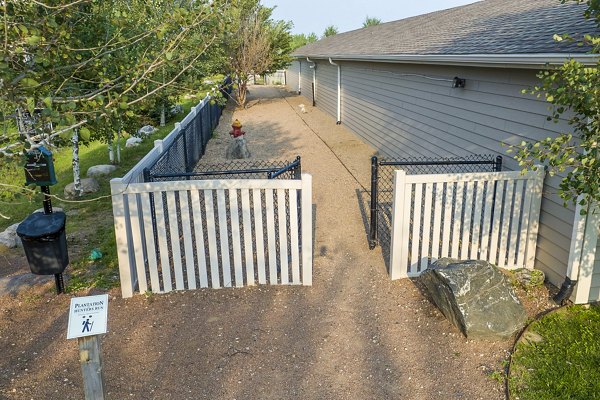 Dog-friendly park at Plantation at Hunters Run Apartments featuring open play areas