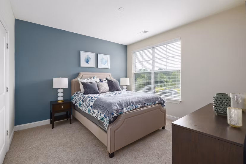Elegant bedroom with modern decor at Parkside Place Apartments, luxury living with convenient access to downtown amenities and attractions