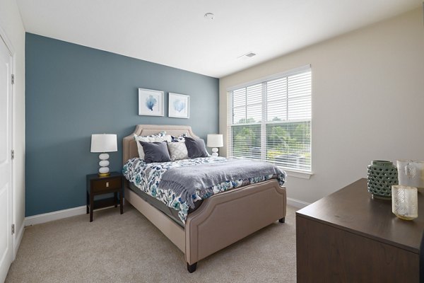 Elegant bedroom with modern decor at Parkside Place Apartments, luxury living with convenient access to downtown amenities and attractions