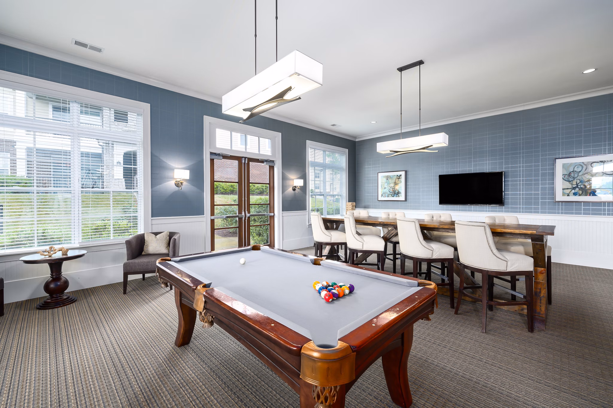 Modern game room with pool table and lounge seating at Parkside Place Apartments, luxury living in vibrant city center