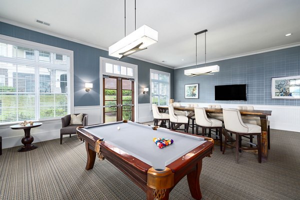 Modern game room with pool table and lounge seating at Parkside Place Apartments, luxury living in vibrant city center