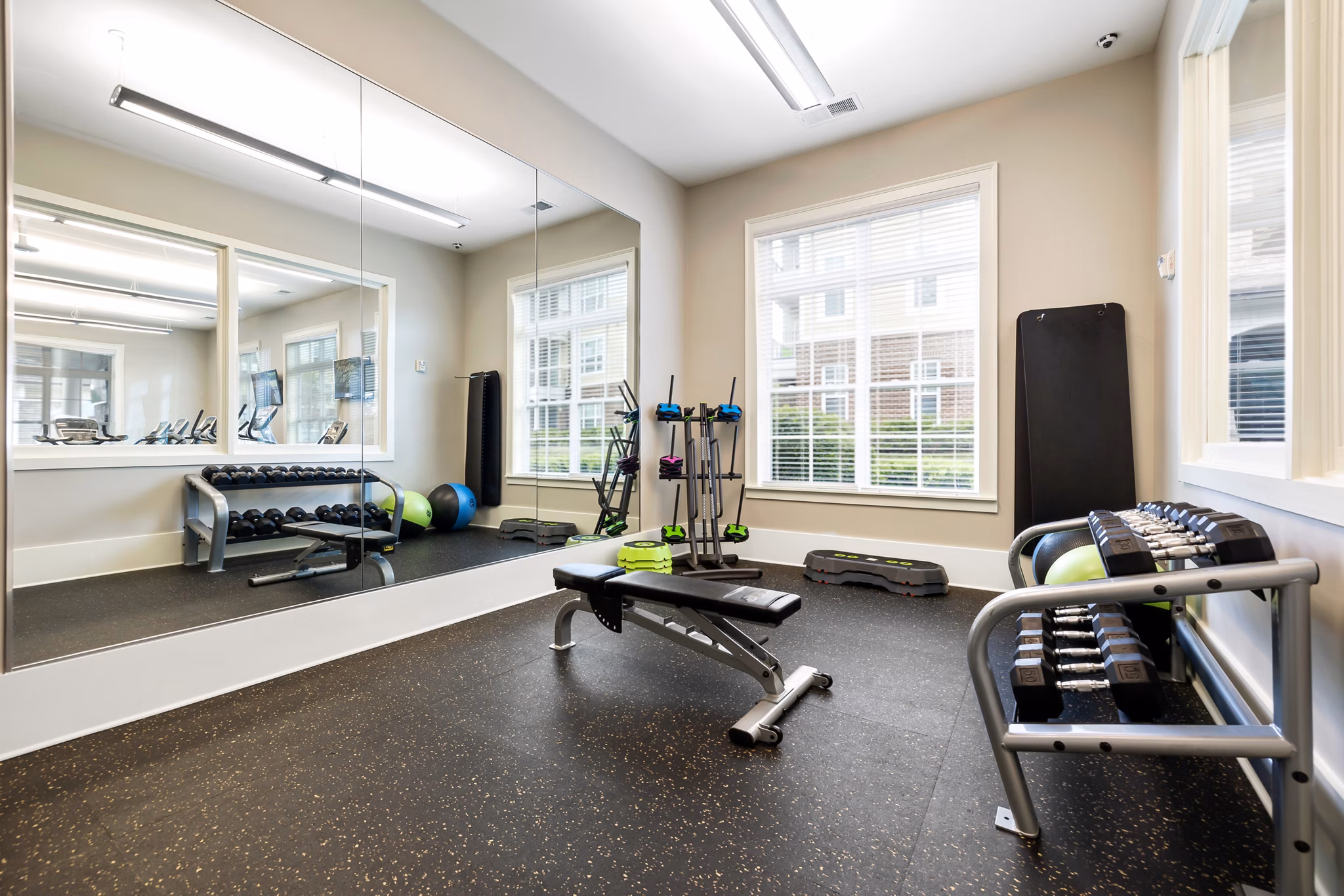 Modern fitness center with state-of-the-art equipment at Parkside Place Apartments