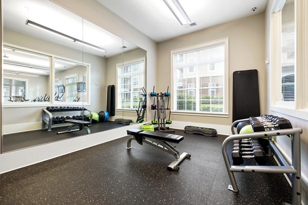 Modern fitness center with state-of-the-art equipment at Parkside Place Apartments