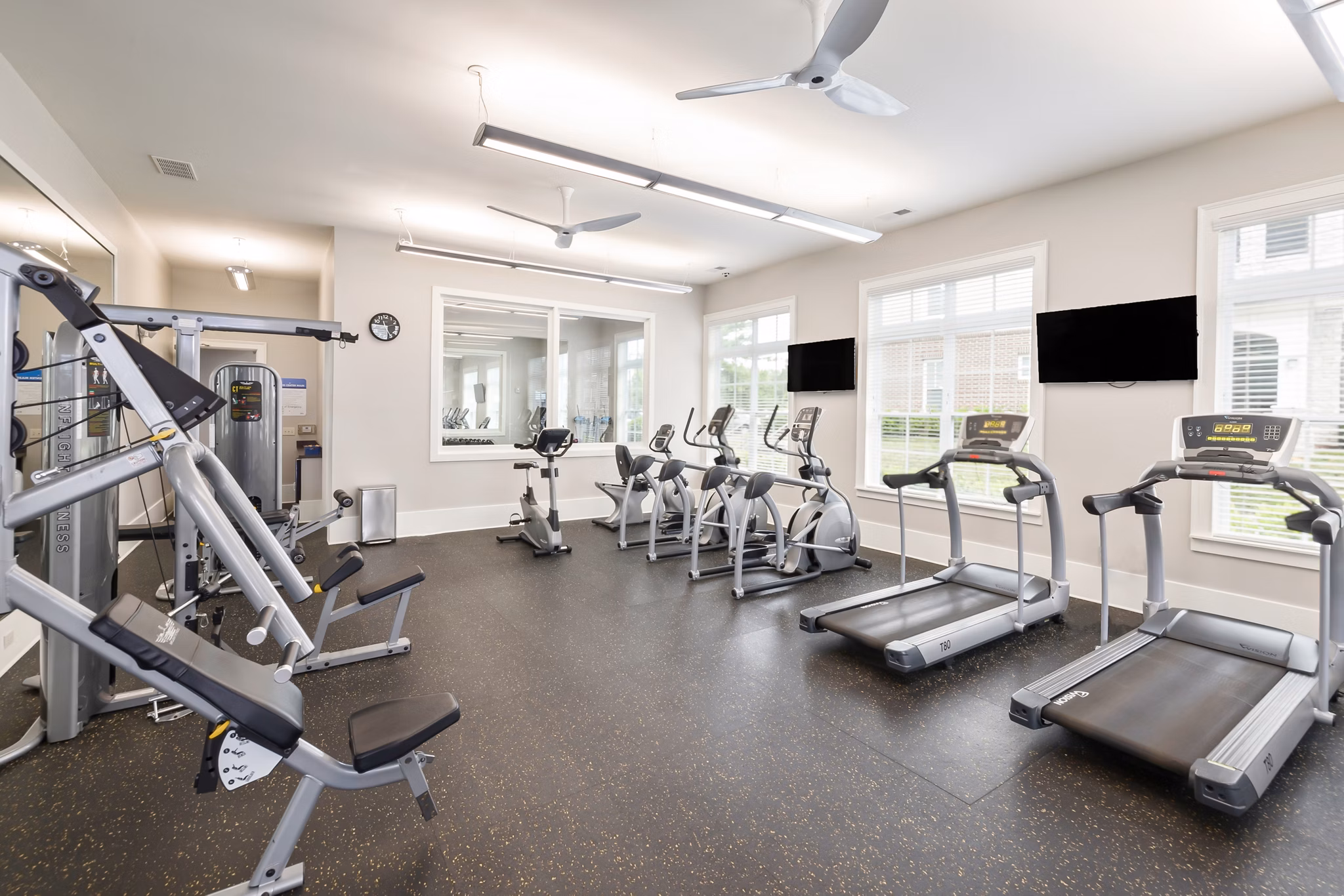 State-of-the-art fitness center with modern equipment at Parkside Place Apartments for wellness-focused living