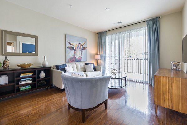 Spacious living room with modern furnishings in Parkside Place Apartments