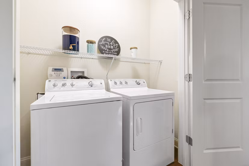 Laundry room with energy-efficient washers and dryers at Parkside Place Apartments