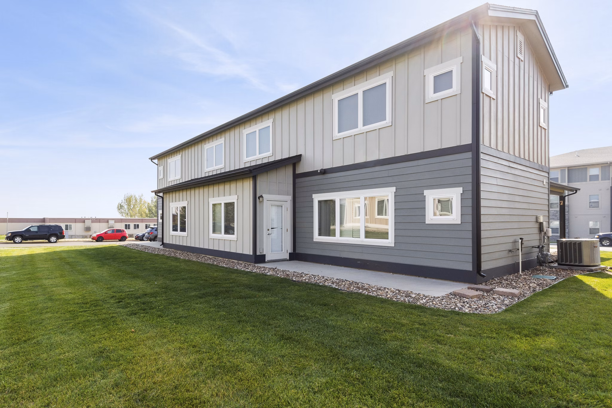 Creekstone Twin Homes: Beautiful of luxury apartments with lush landscaping in a serene neighborhood
