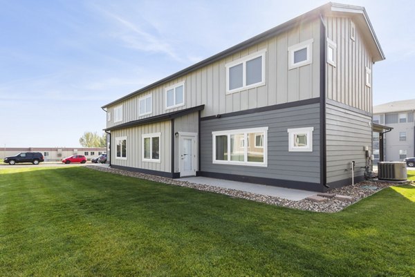 Creekstone Twin Homes: Beautiful of luxury apartments with lush landscaping in a serene neighborhood