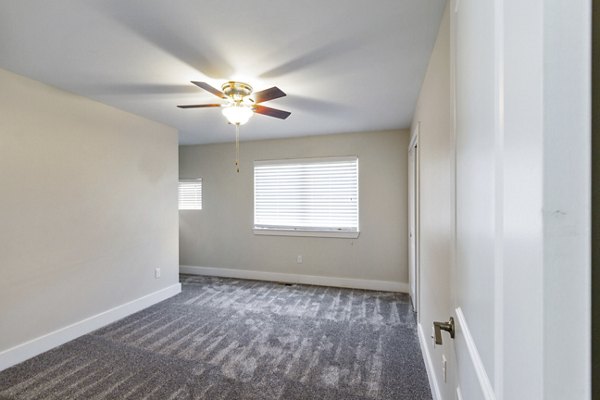 Spacious bedroom featuring elegant decor at Creekstone Twin Homes