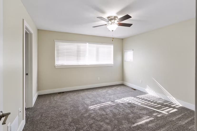 Bedroom featuring modern decor and ample natural light in Creekstone Twin Homes luxury apartments