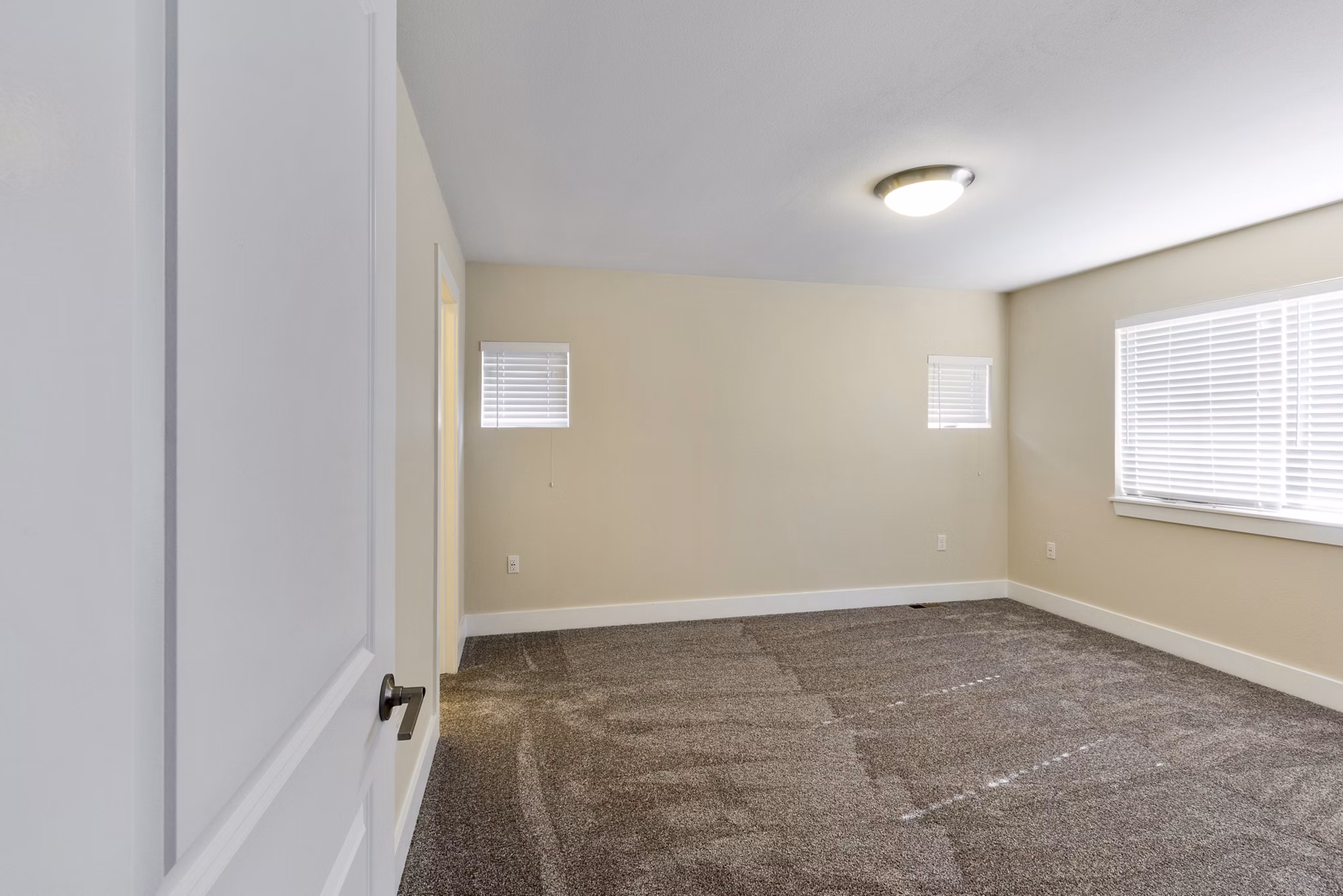 Spacious bedroom with natural light and modern design at Creekstone Twin Homes