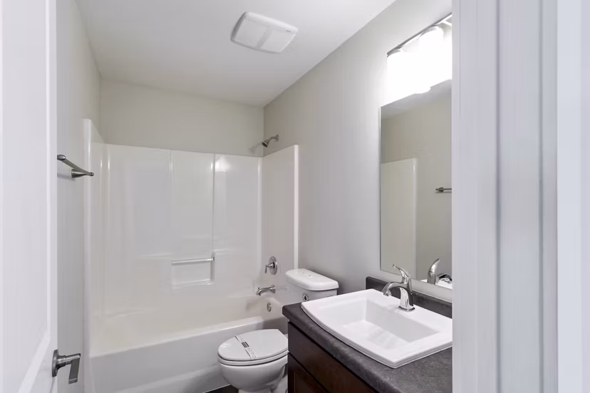 Luxury bathroom with marble countertops and elegant fixtures in Creekstone Twin Homes