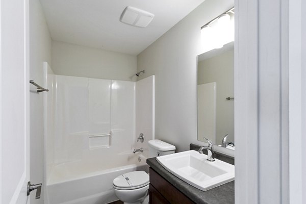 Luxury bathroom with marble countertops and elegant fixtures in Creekstone Twin Homes