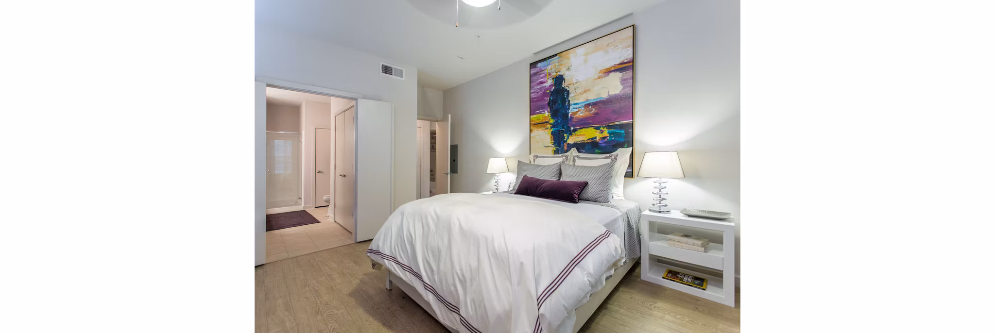 Cozy bedroom with modern furnishings at Dalian Monterrey Village Apartments