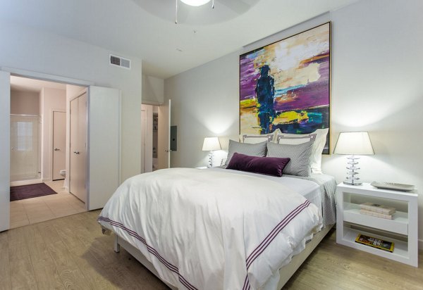 Cozy bedroom with modern furnishings at Dalian Monterrey Village Apartments