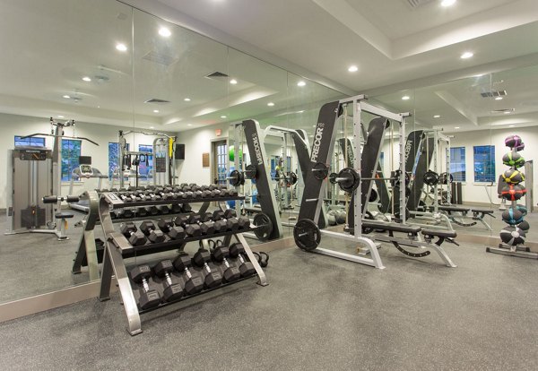State-of-the-art fitness center with gym equipment at Dalian Monterrey Village Apartments