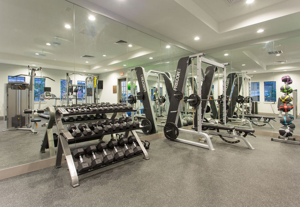 State-of-the-art fitness center with gym equipment at Dalian Monterrey Village Apartments