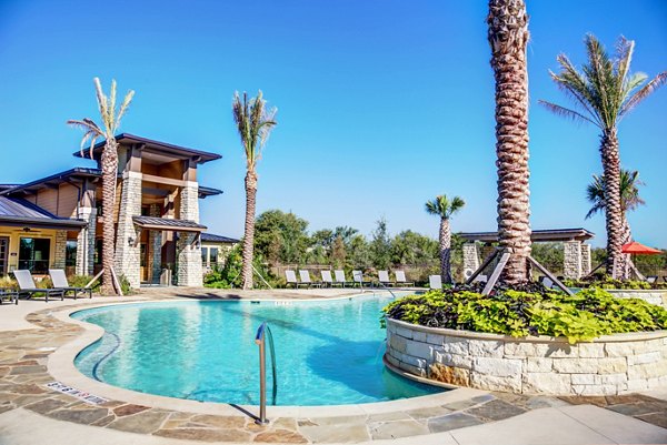 Resort-style pool with sun loungers at Dalian Monterrey Village Apartments