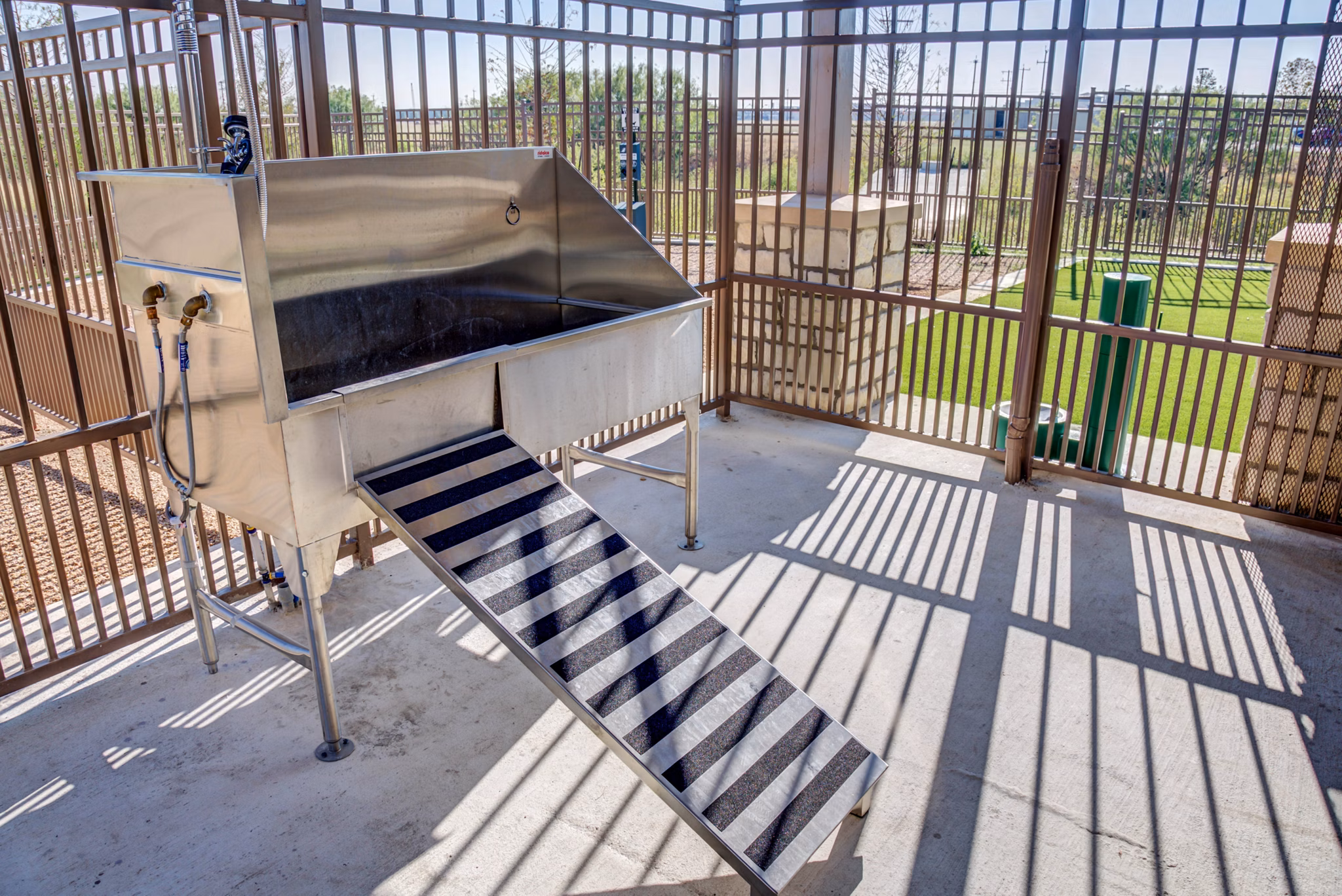 Dog wash station at Dalian Monterrey Village Apartments with modern grooming facilities for pet-friendly living