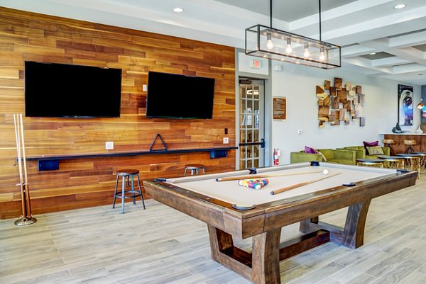 Contemporary game room with billiards and seating at Dalian Monterrey Village Apartments
