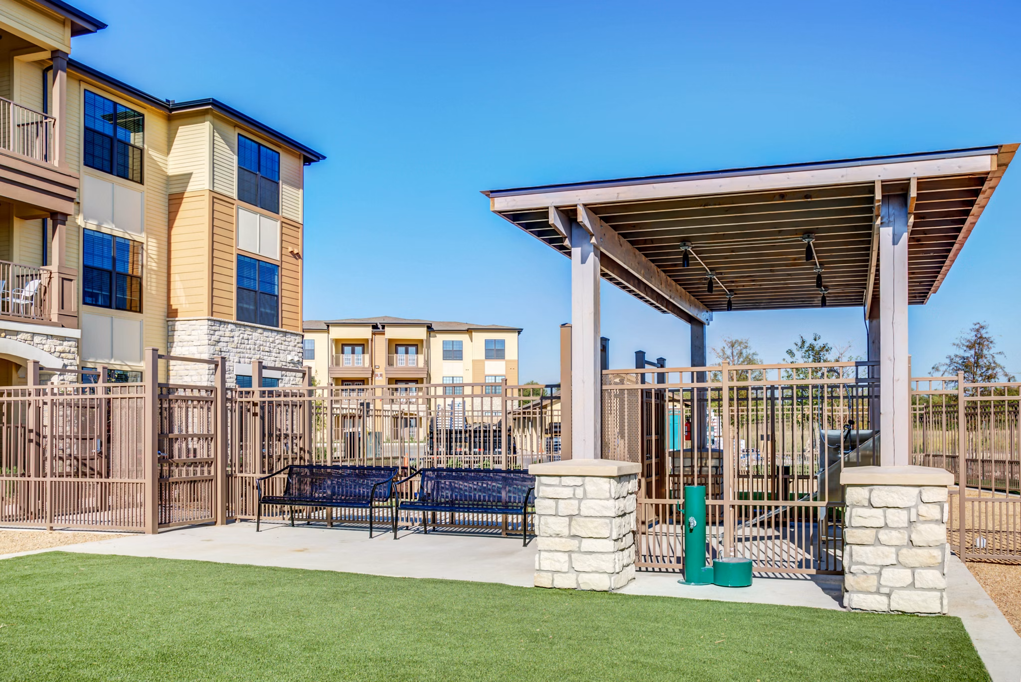 Dog park with agility equipment at Dalian Monterrey Village Apartments
