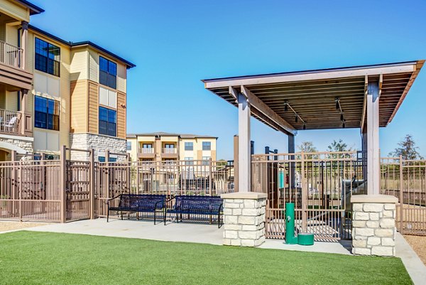 Dog park with agility equipment at Dalian Monterrey Village Apartments