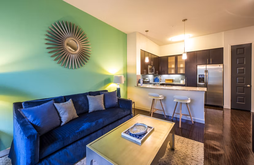 Spacious living room featuring modern decor at Accent Apartments, luxury residences by Greystar in a vibrant urban setting
