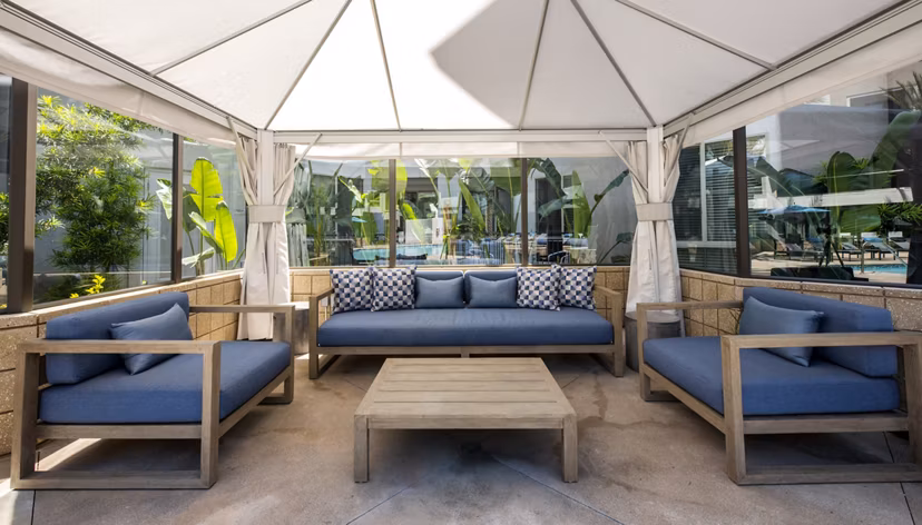 Chic patio with modern furnishings in Accent Apartments, ideal for relaxation and social gatherings