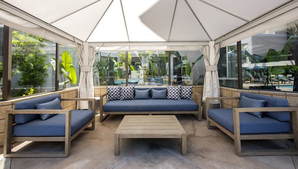 Chic patio with modern furnishings in Accent Apartments, ideal for relaxation and social gatherings