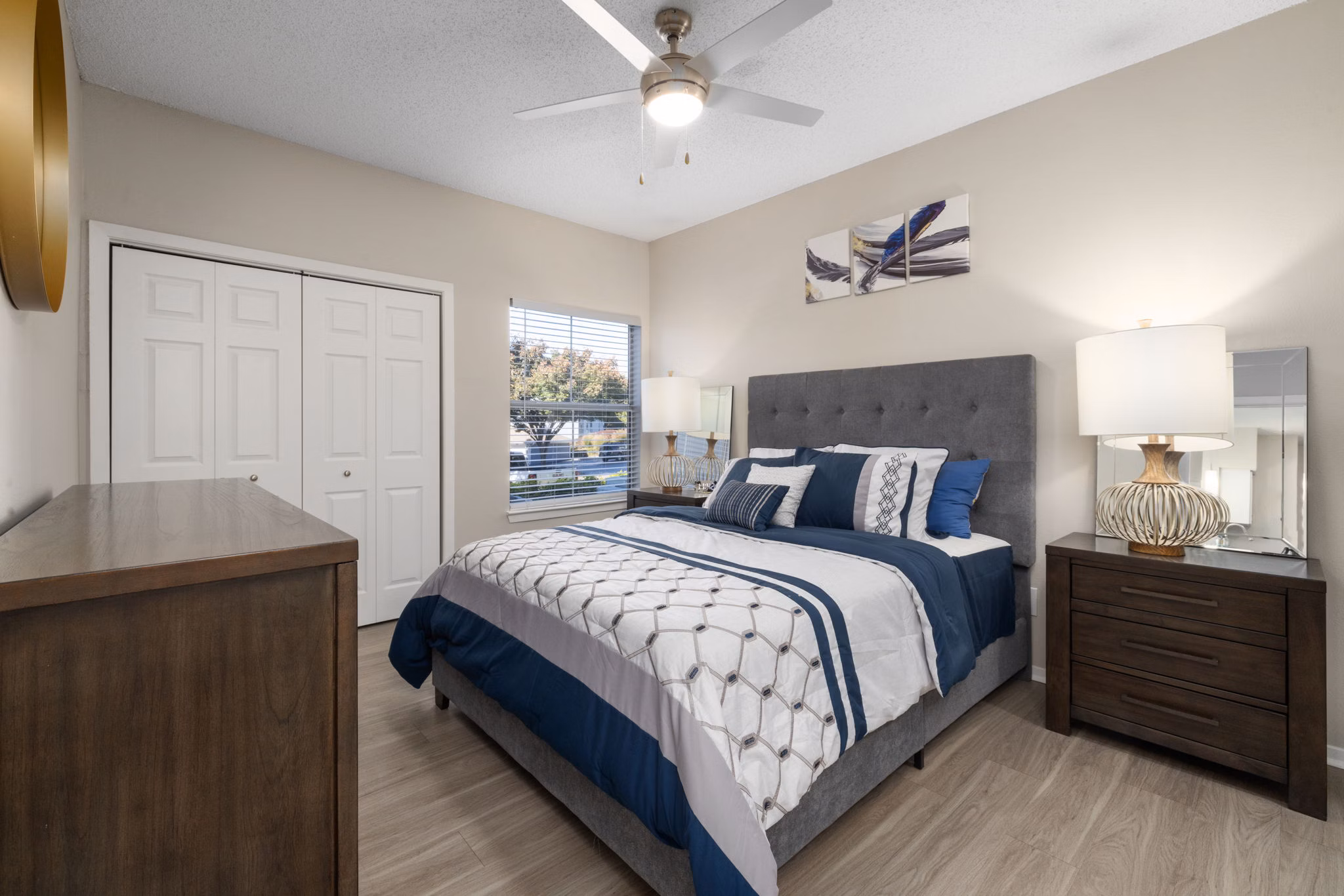 Modern bedroom with elegant decor at The Riley Apartments