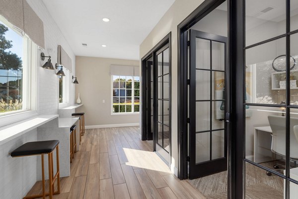 Luxurious clubhouse with modern furnishings at The Riley Apartments featuring ample social spaces