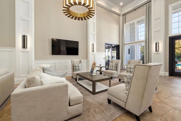 Clubhouse with modern seating and bright lighting at The Riley Apartments, a luxury community offering premium facilities