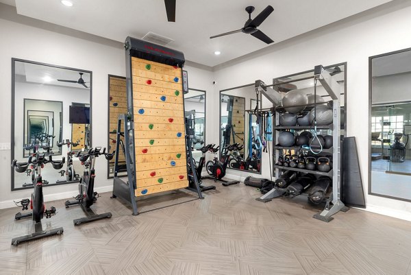Fitness center with state-of-the-art equipment at The Riley Apartments