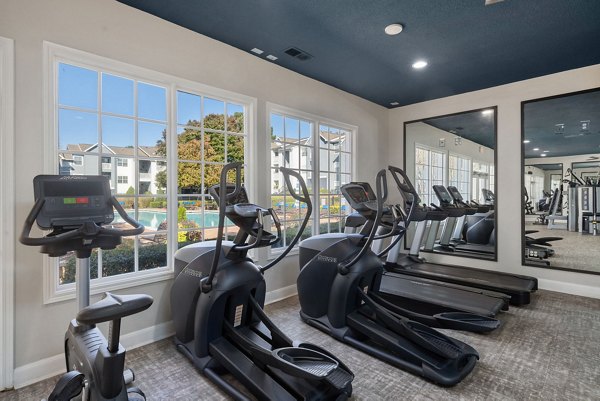 State-of-the-art fitness center with modern equipment at The Riley Apartments for residents seeking an active lifestyle