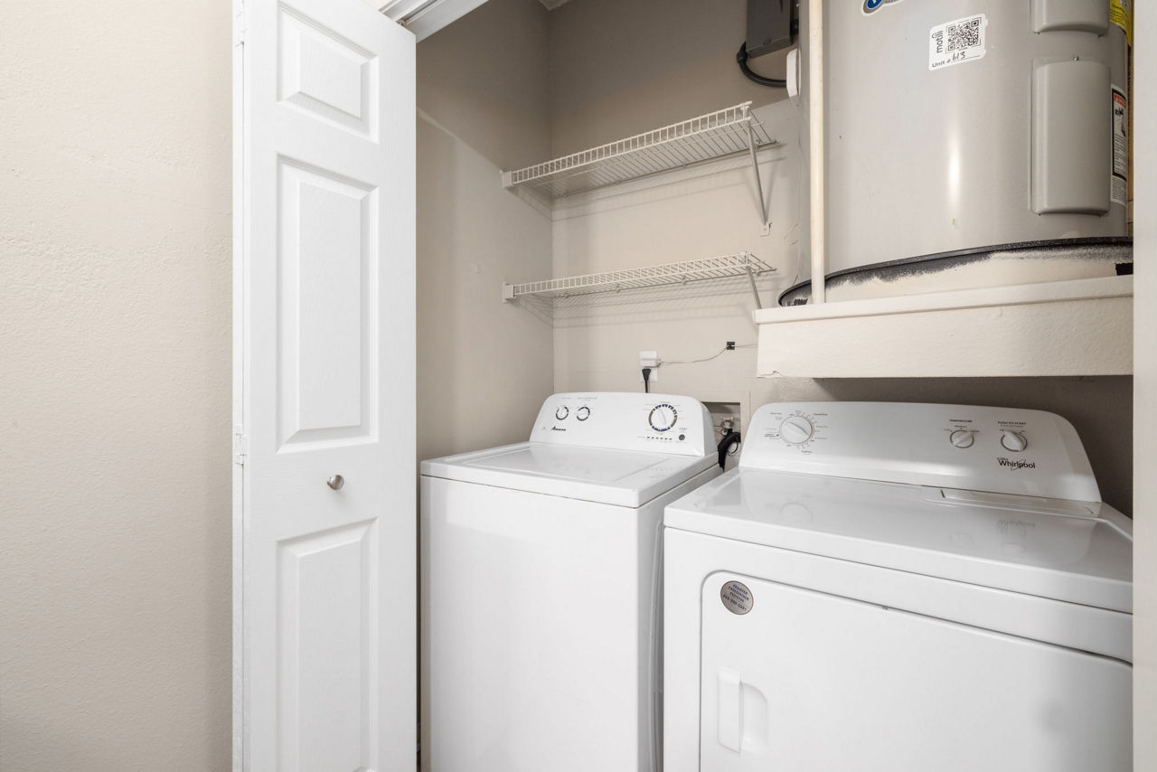 Laundry room at The Riley Apartments