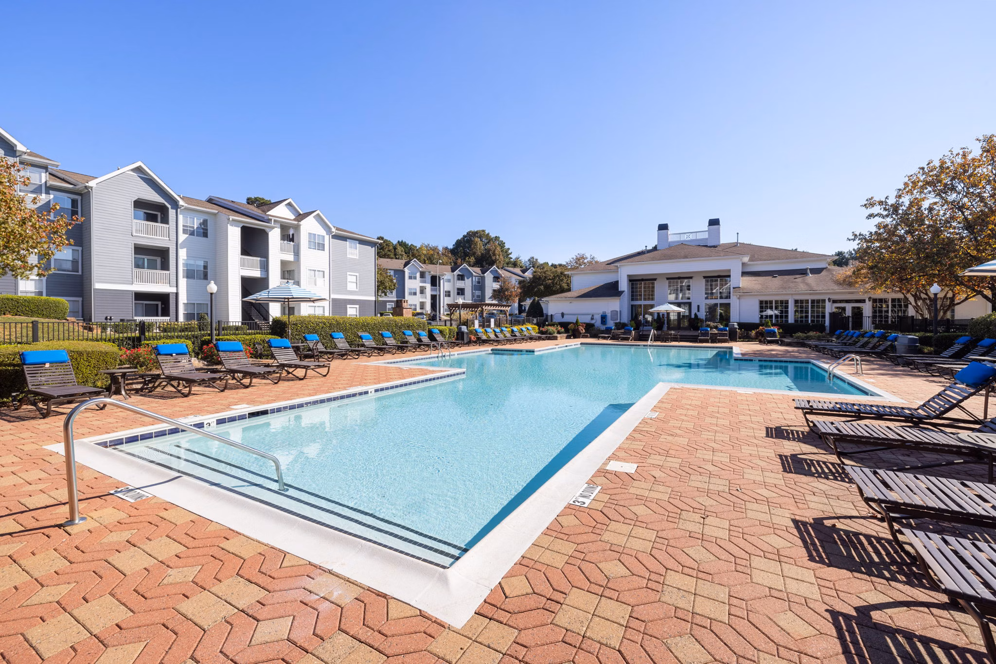 Inviting outdoor pool at The Riley Apartments, perfect for relaxation and gatherings