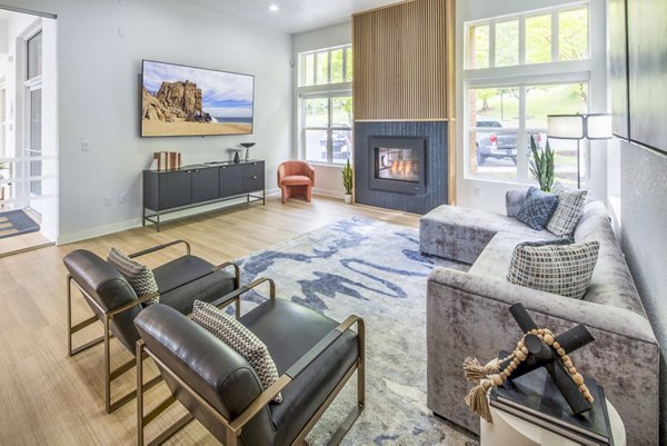 Clubhouse at Arbor Heights Apartments: Modern lounge spaces with cozy seating and a billiard table