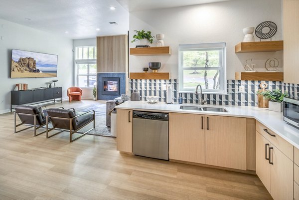 Clubhouse kitchen with modern appliances at Arbor Heights Apartments, perfect for hosting gatherings and culinary experiences in a luxury setting