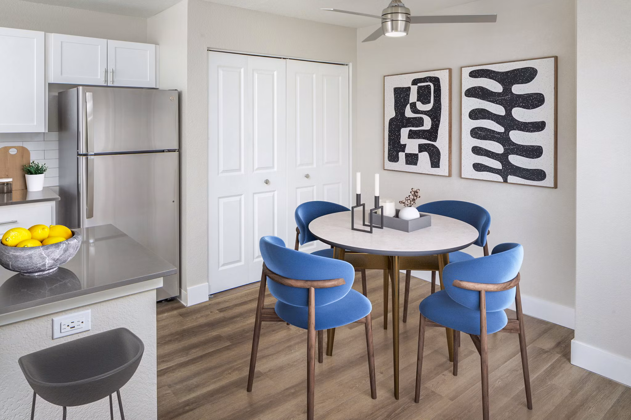 Dining room with elegant chandelier and modern decor at Arbor Heights Apartments