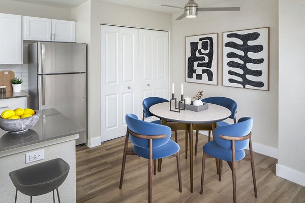 Dining room with elegant chandelier and modern decor at Arbor Heights Apartments