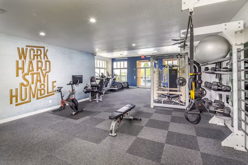 State-of-the-art fitness center at Arbor Heights Apartments offering modern equipment and vibrant workout spaces for residents