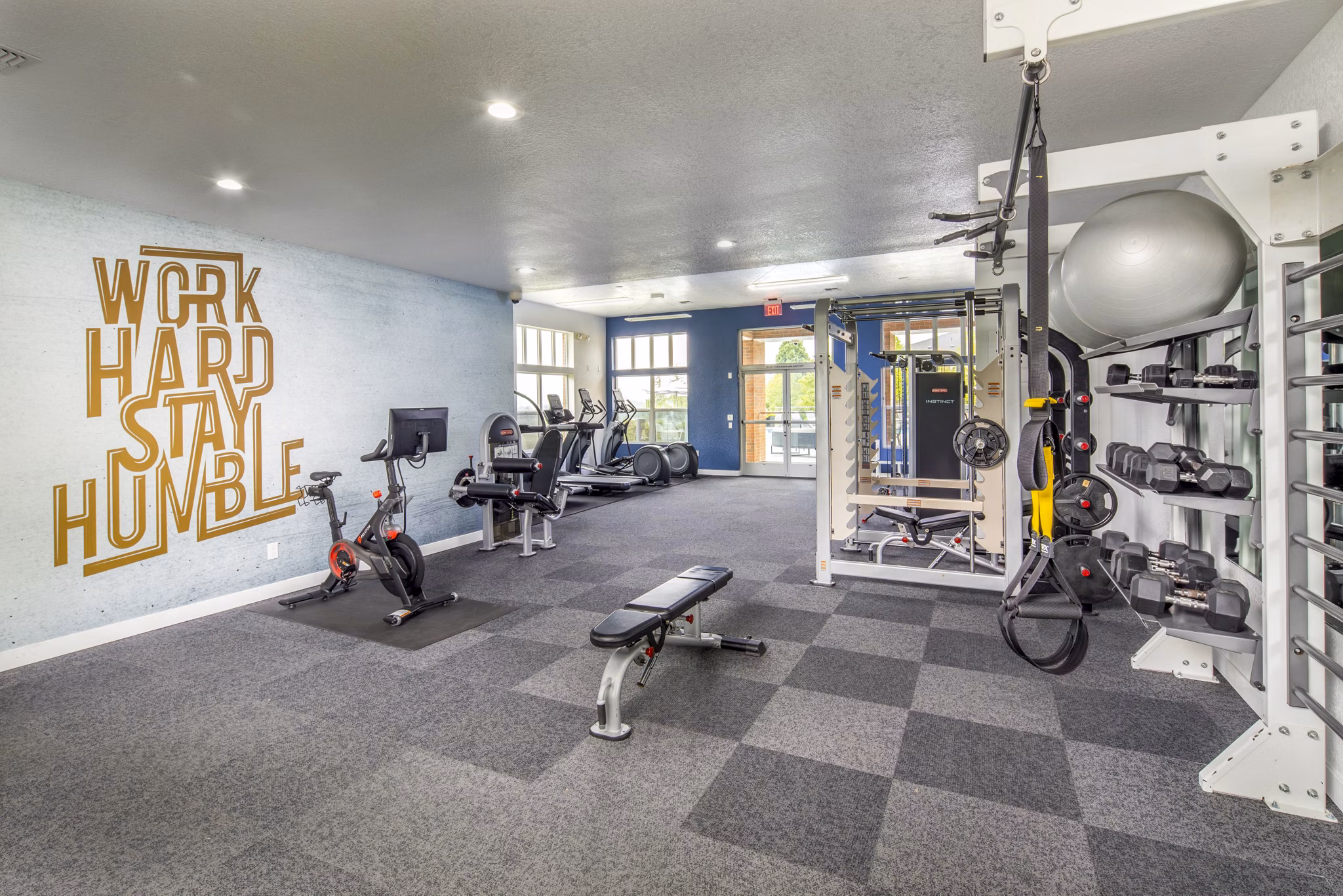 State-of-the-art fitness center at Arbor Heights Apartments offering modern equipment and vibrant workout spaces for residents