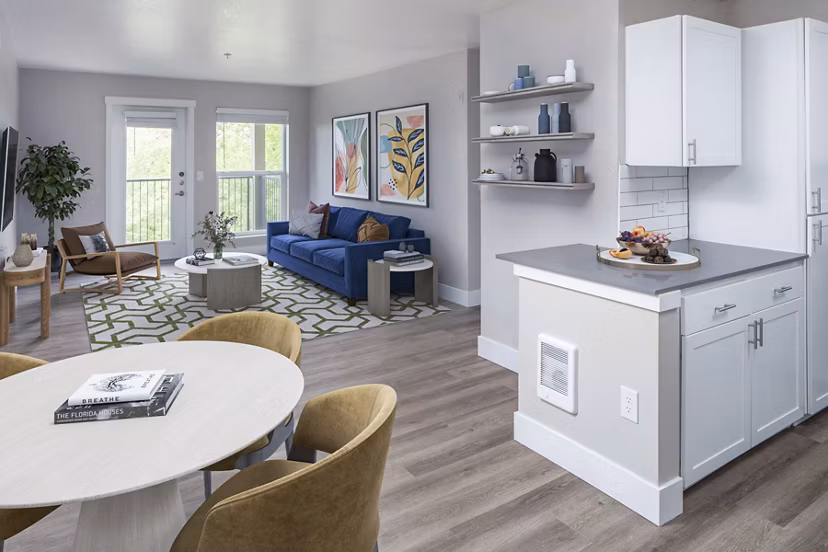 Living room featuring modern furniture and natural light at Arbor Heights Apartments