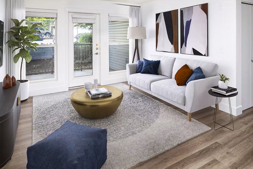 Spacious living room with modern decor in Arbor Heights Apartments