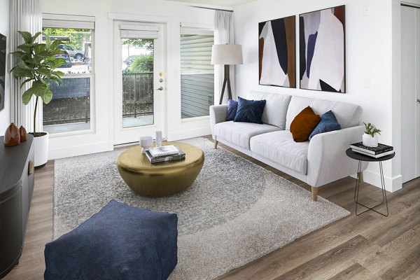 Spacious living room with modern decor in Arbor Heights Apartments