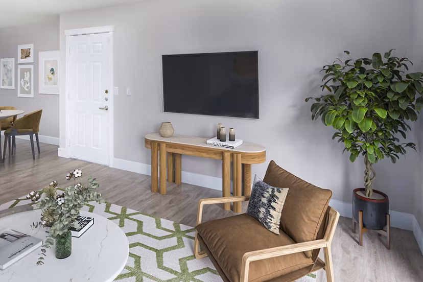 Cozy living room with modern decor and natural light in Arbor Heights Apartments