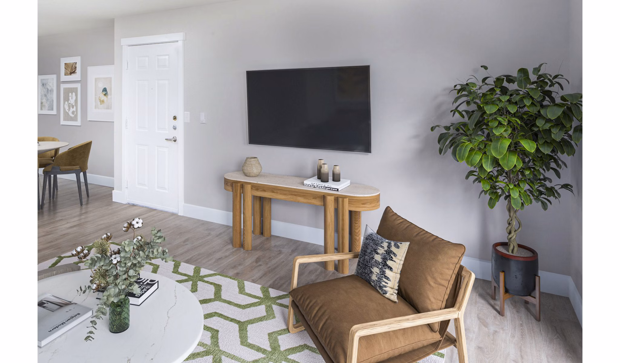 Cozy living room with modern decor and natural light in Arbor Heights Apartments