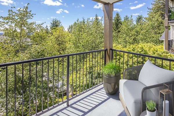 Modern patio/balcony with outdoor seating at Arbor Heights Apartments